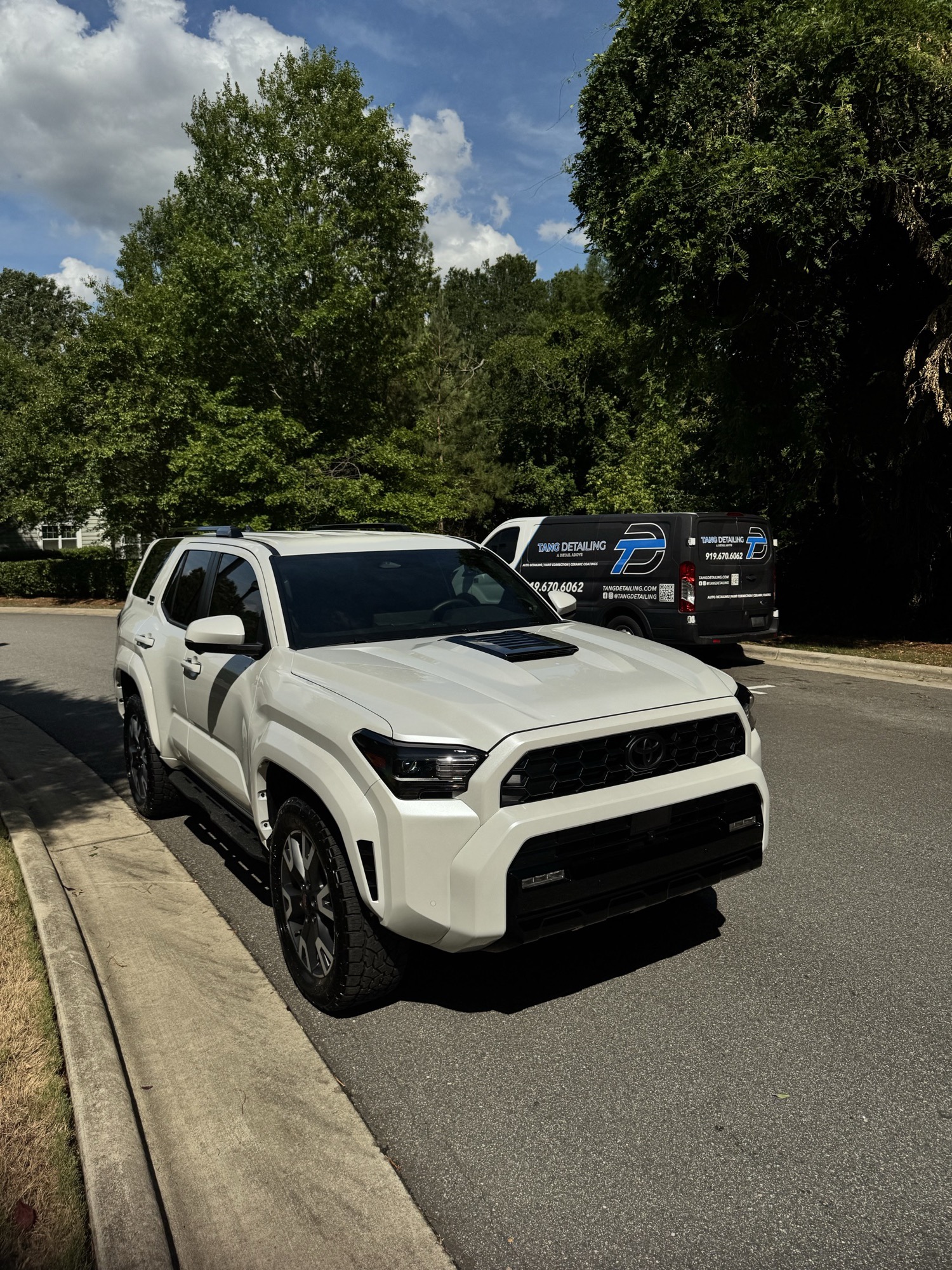 2026 Toyota 4Runner parked beside the Tang Detailing van after its 7-year ceramic coating in Raleigh NC