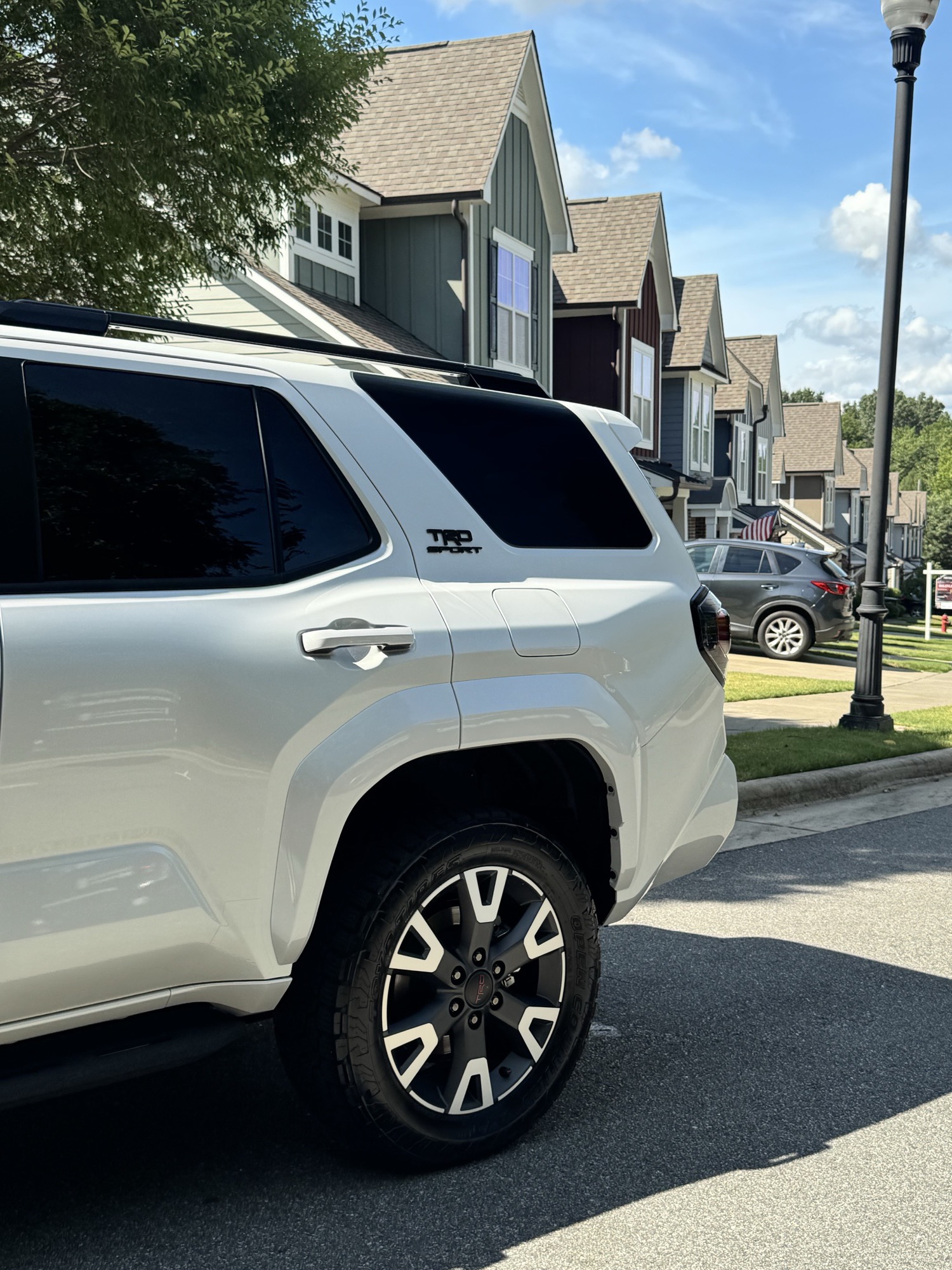 Close-up of the glossy ceramic-coated paint and wheel on the 2026 Toyota 4Runner in Raleigh NC
