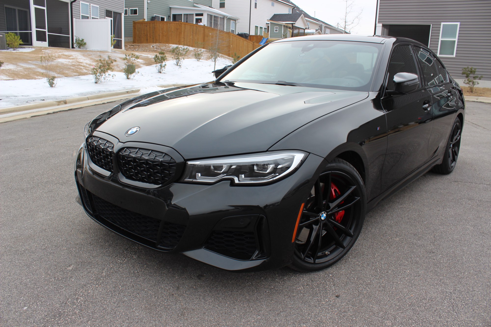 Deep, swirl-free black paint on the BMW M340i after correction in Raleigh NC