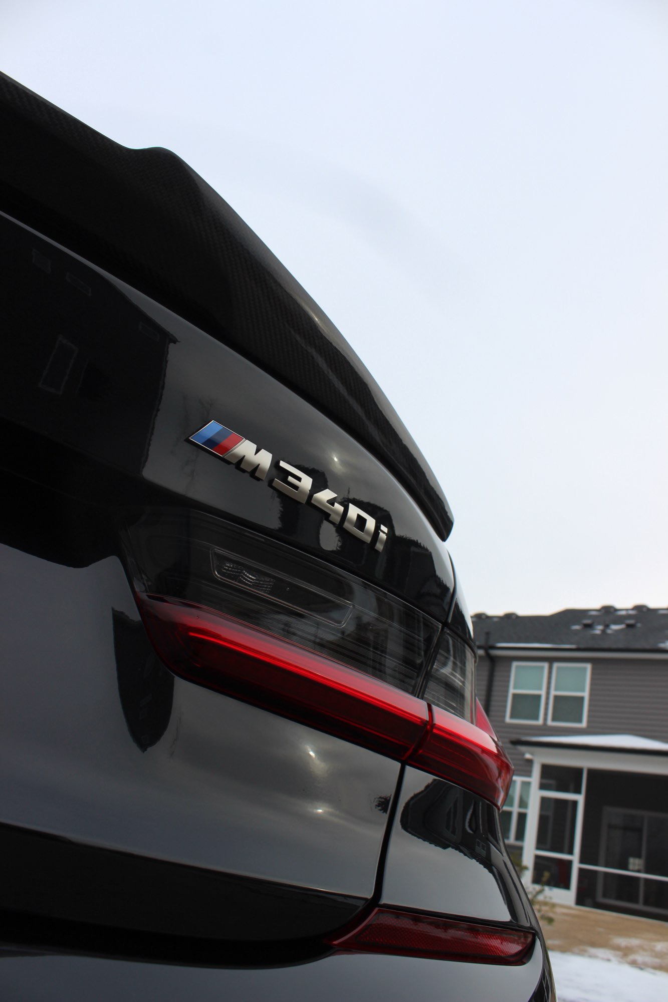 Restored gloss and reflection on the corrected black BMW M340i in Raleigh NC