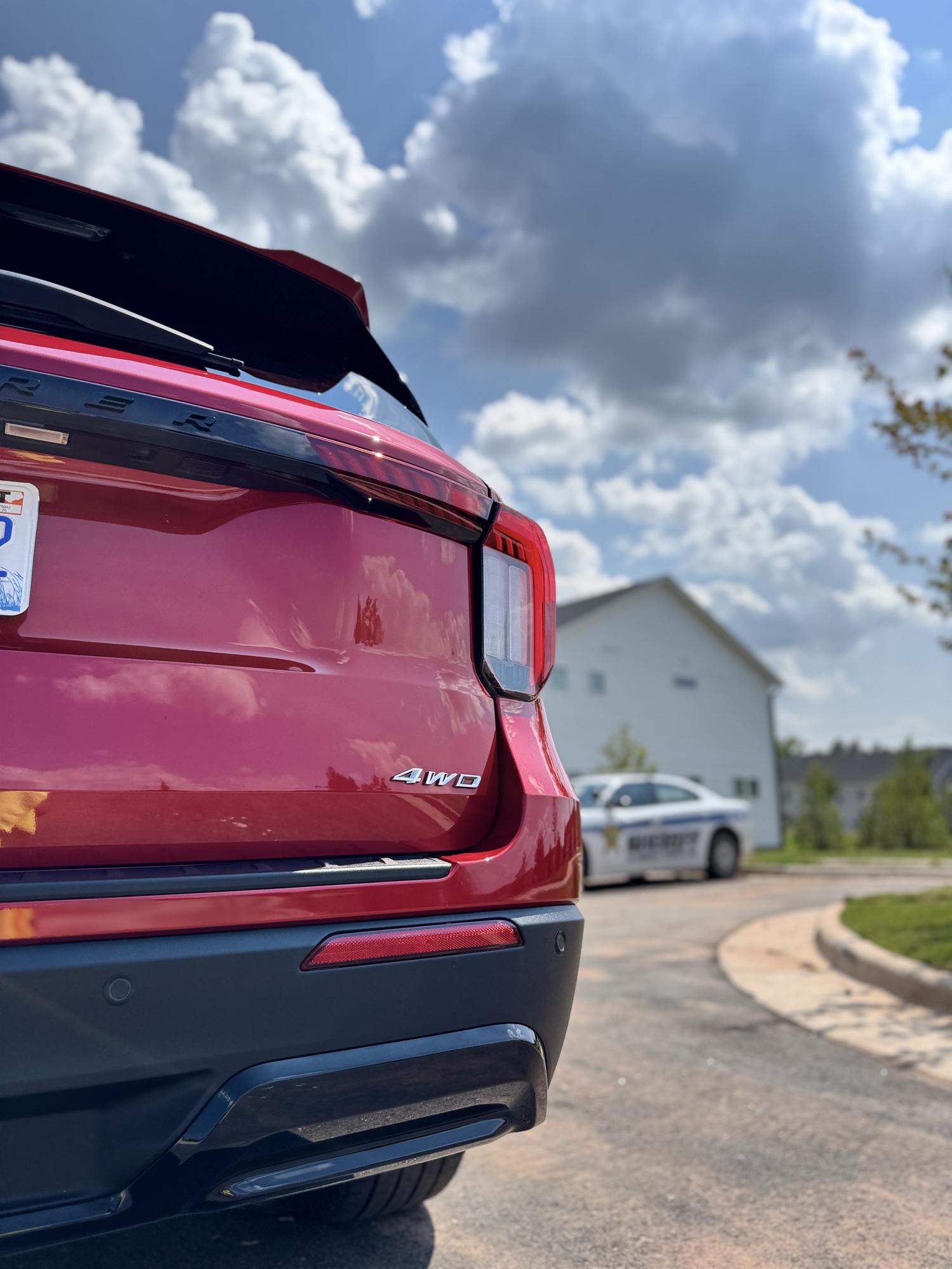 Rear tailgate and deep red paint of the 2026 Ford Explorer ST reflecting after paint correction and ceramic coating in Raleigh NC