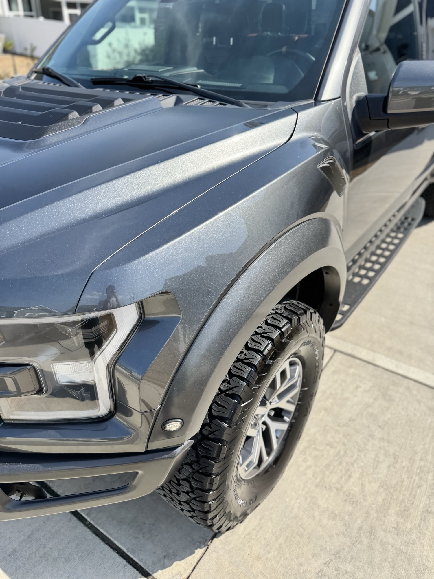 Glossy corrected front fender and wheel of the 2020 Ford Raptor after ceramic coating in Wake Forest NC