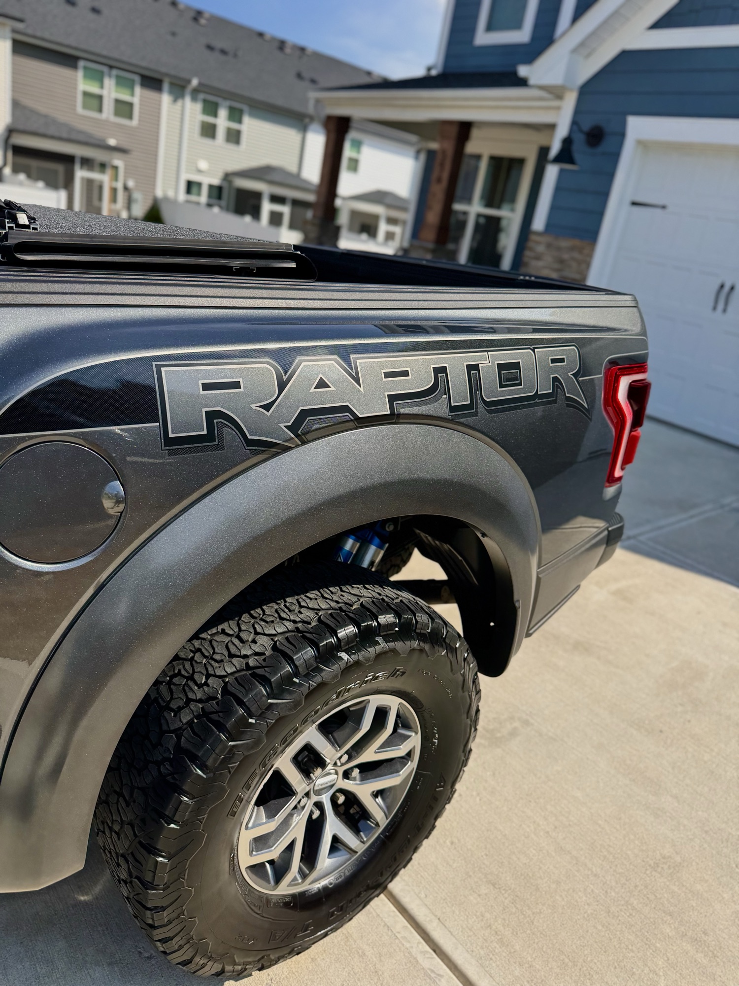 Rear bedside RAPTOR badge and wheel with a deep gloss finish after paint correction and ceramic coating in Wake Forest NC