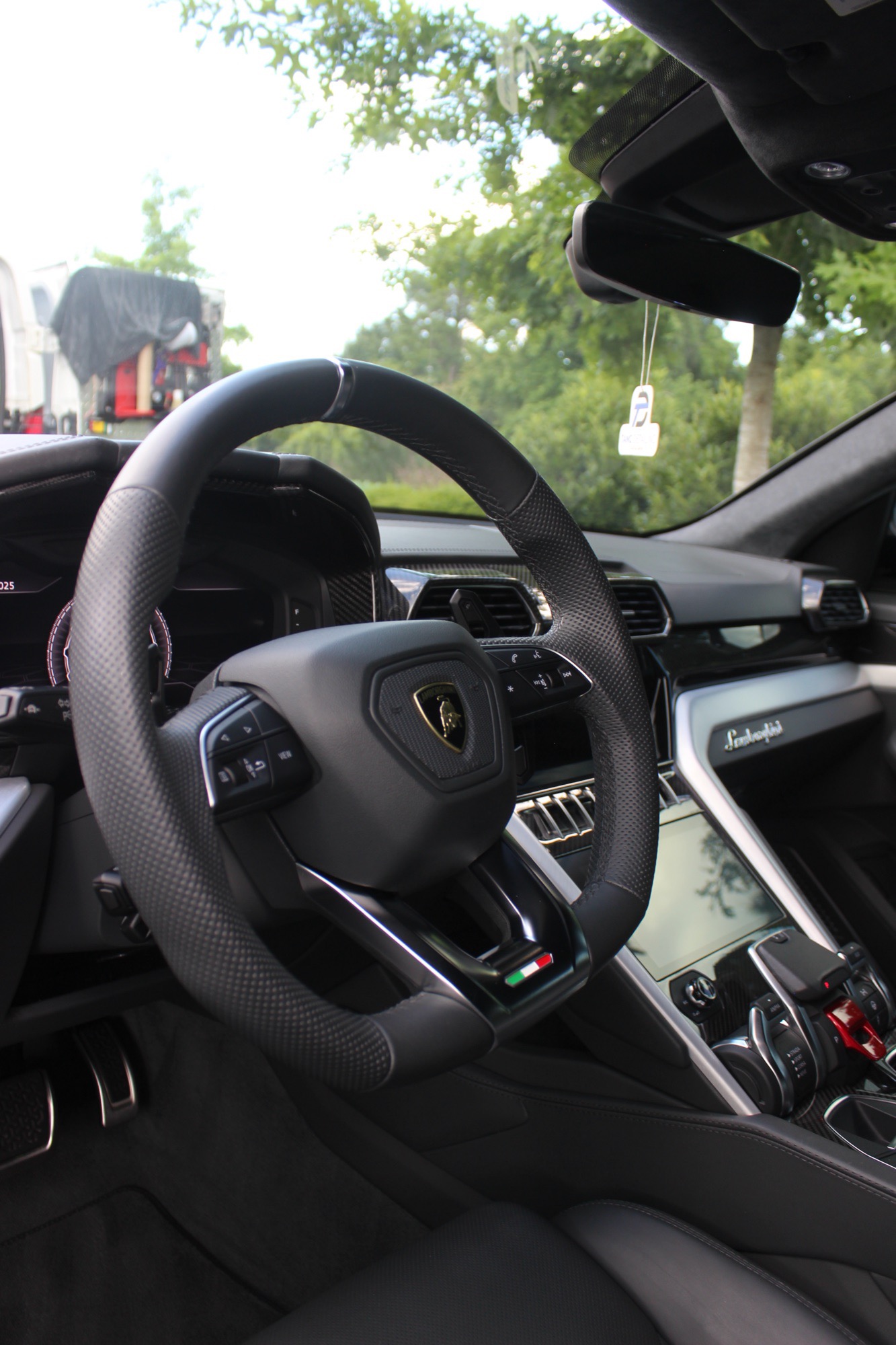 Detailed interior of the 2024 Lamborghini Urus — steering wheel and Lamborghini dashboard after a full interior cleaning in Raleigh NC