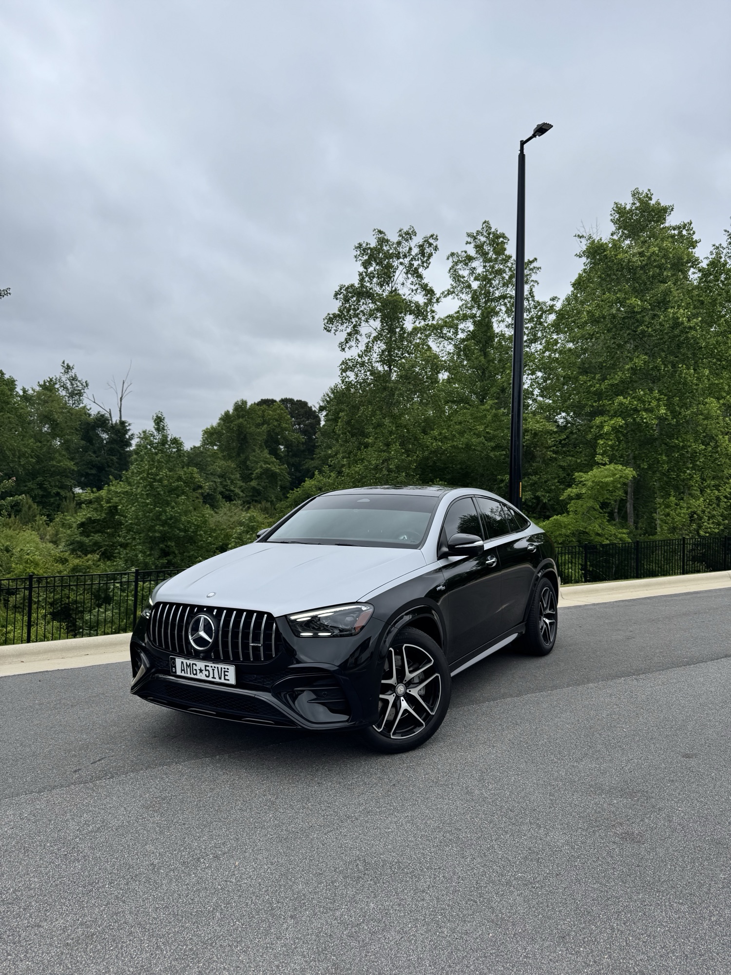 Full front three-quarter of the black 2024 Mercedes-AMG GLE Coupe restored to true black after paint correction and ceramic coating in Wake Forest NC