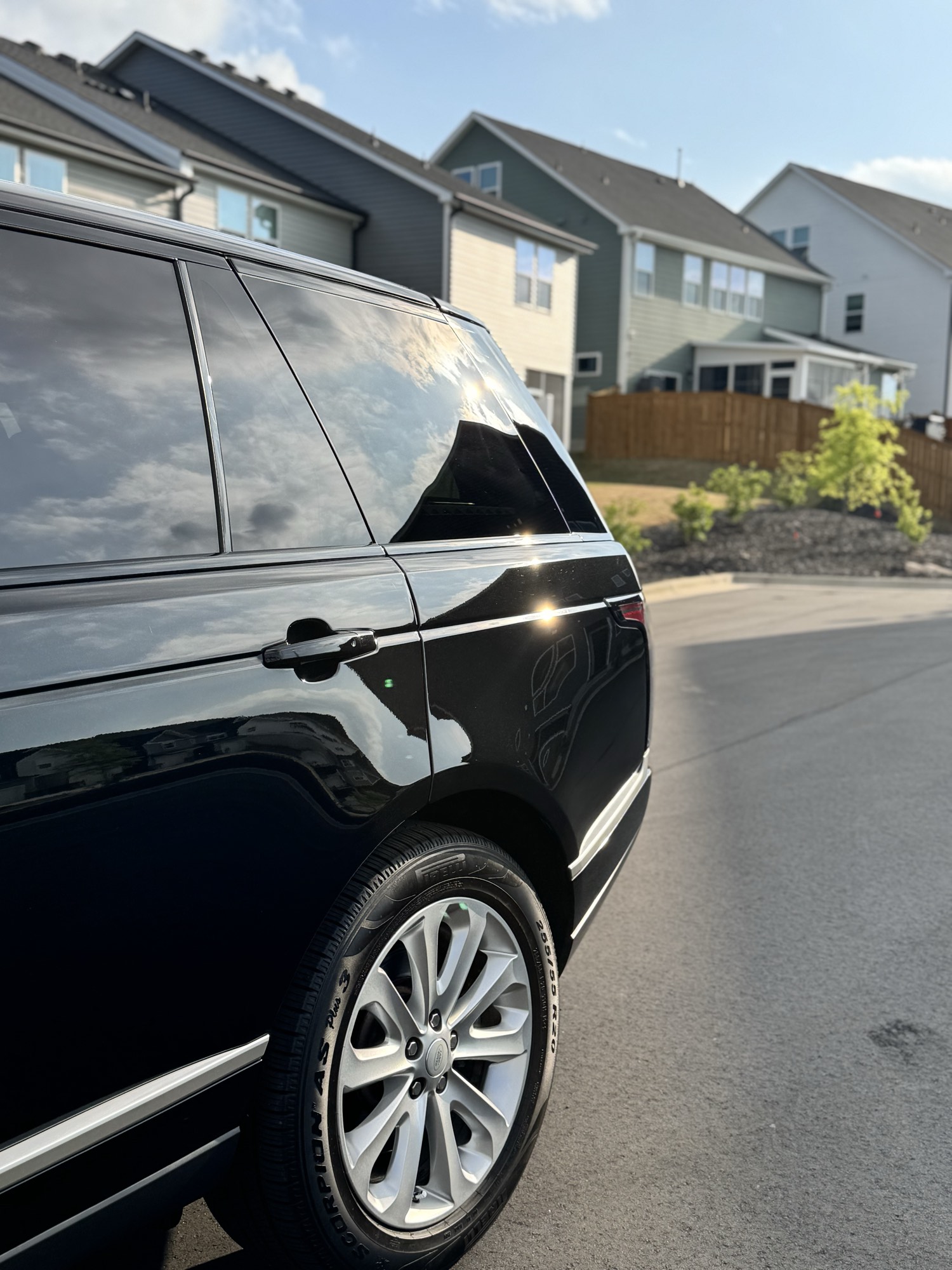 Deep black rear quarter and glass of the 2019 Range Rover reflecting after a 7-year ceramic coating in Wake Forest NC